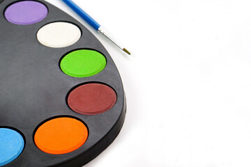 Art palette with paint and blur brush on white background. Learning and paintings art concept.