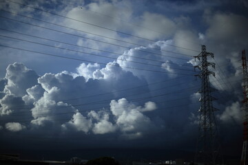 Cumulonimbus (from Latin cumulus 'swell' and nimbus 'cloud') is a dense, towering, vertical cloud,...