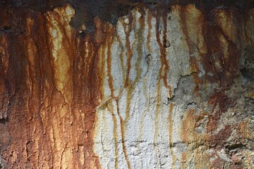 exterior of old building rust streaks and deterioration