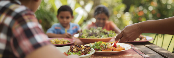 Family Enjoying Outdoor Meal with Colorful Salads and Grilled Vegetables in a Garden Setting