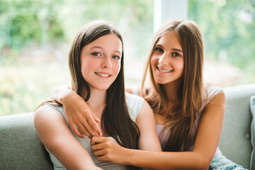 Fototapeta premium Two best girls having fun together on white studio