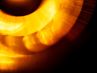 Light orange warm color light leak on dark background for design use and special effects. Abstract...
