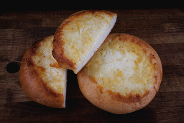 Khachapuri. Bun with cheese, cut and whole.