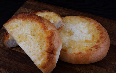 Khachapuri. Bun with cheese, cut and whole.