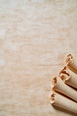 Vintage rolled parchment scrolls on a textured background. Perfect for historical, antique, or educational design themes.