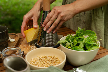 Fresh Pesto Creation: Blending Basil, Pine Nuts, Garlic, Parmesan, and Olive Oil