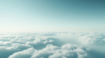 Naklejka premium A breathtaking view above the clouds with a serene blue sky, capturing the tranquility and expanse of nature.
