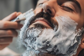 Close-up of a man with a lathered beard being trimmed by a barber, showcasing the precision and care in grooming facial hair.