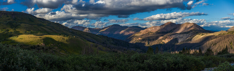 Mountain valley panorama at sunset with dramatic lighting