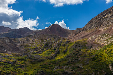mountain peak with tundra meadow slopes