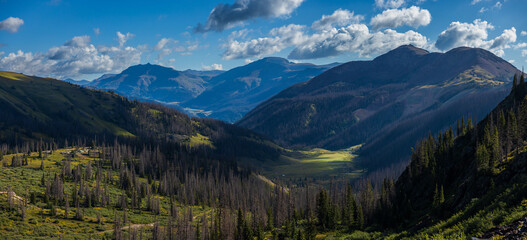 Fototapeta premium Early morning mountain valley clouds and dramatic lighting