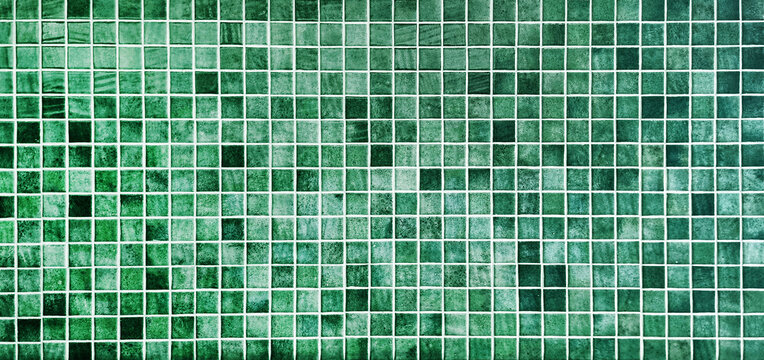 green ceramic mosaic tile background. trendy vintage ceramic tiles to decorate the interior wall or floor. multi green color tone of ceramic tiles. furnishing material for interior decoration.