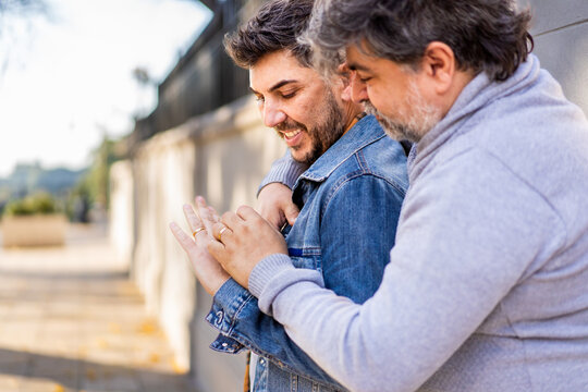 Gay couple enjoying a heartfelt moment outdoors