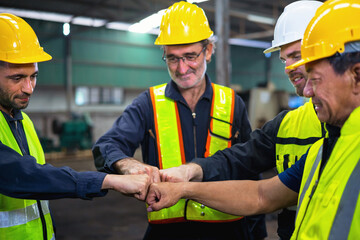  group of construction workers are shaking hands