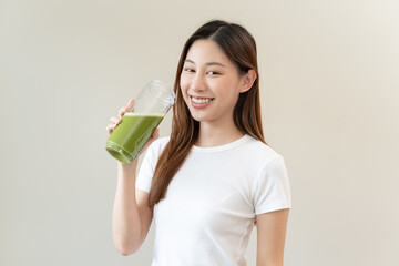 young woman drinking detox drink made by vegetable and fruit mixed.