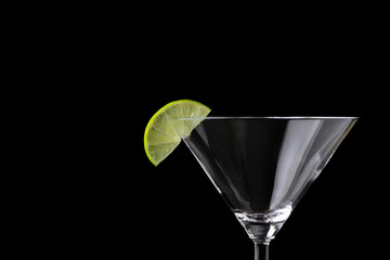 Empty Martini glass with a lime slice