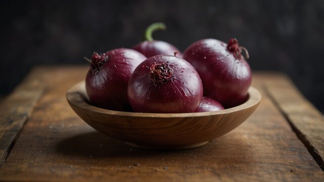 Bowl of fresh red onions on a wooden board.