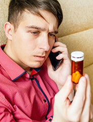 Fototapeta premium Sad Young Man with a Pills