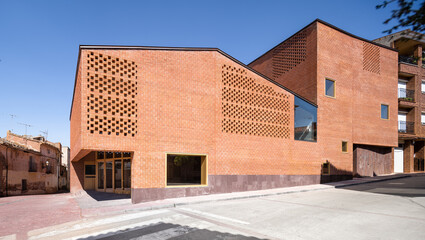 Modern auditorium exterior with distinctive brick design