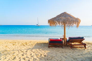 summer beach with sunbeds, Mykonos island, Greece