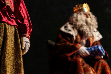 Wise men in opulent costumes bearing gifts