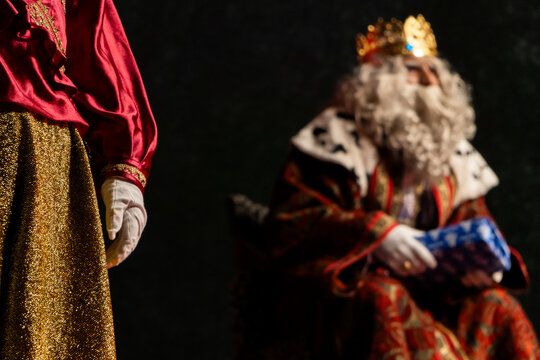 Wise men in opulent costumes bearing gifts