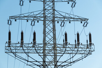 Power lines against blue sky.