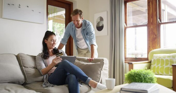 Credit Card, tablet and happy couple typing online shopping payment, discount code or reading fintech banking deal. Digital money exchange, home customer sales and people search ecommerce marketplace