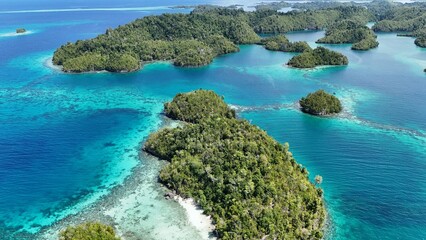 Aerial View of the Thousand Islands in the Togean National Park, Central Sulawesi, Indonesia. Similar to Piyanemo view in Raja Ampat.  © Daytdreaming Shoots