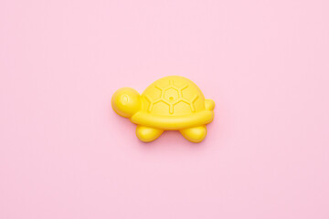 Plastic beach toy pastel color on pink background. The development of fine motor concept. Creativity Game and summer concept.
