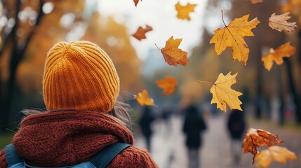 A brisk, windy autumn day with leaves swirling through the air and people bundled up in warm clothing