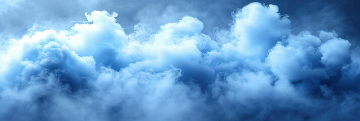 Fototapeta premium Soft blue clouds float in the morning sky, creating a serene atmosphere