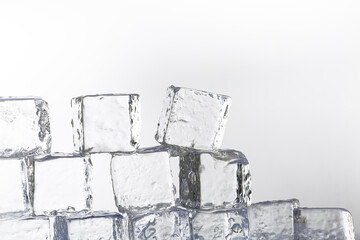 Ice cube isolated on white background,Natural crystal clear melting ice cubes on white reflective...