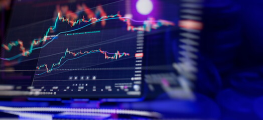 Businessman analyzing investment charts on tablet computer. Business, finance and technology concept.