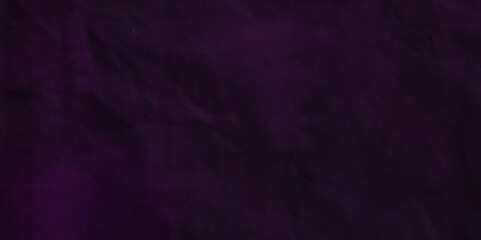 Purple crumpled paper texture in low light background. Silk cloth texture. Fabric pattern. crumpled kraft paper. A crumpled sheet of dark pink and purple paper abstract background. old paper texture. 