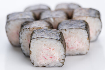 Sushi set and composition at white background. Japanese food restaurant, sushi maki gunkan roll plate or platter set.