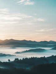 Fototapeta premium Misty mountain landscape at sunrise with soft light and rolling hills