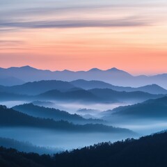 Obraz premium Misty mountains at dawn with colorful sky near the horizon