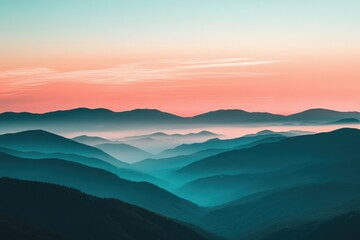 Obraz premium Serene sunrise over misty mountain ranges at dawn