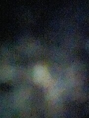 Defocused dark abstract background with grainy effect