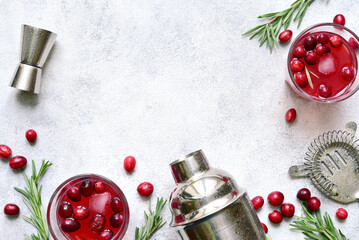 Christmas cranberry cocktail with rosemary. Top view with copy space.