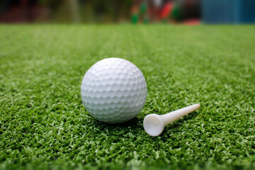 Golf ball placed on artificial grass.