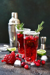 Cranberry cocktail with pomegranate and rosemary.