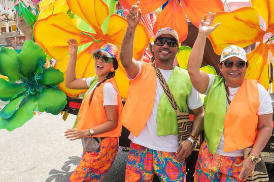 people in vibrant attire celebrating at a street festival