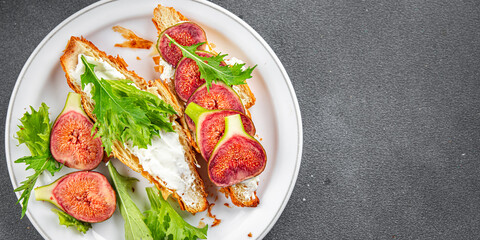 sandwich fig croissant, cream cheese fresh meal food snack on the table copy space food background rustic top view vegetarian vegan food