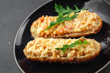smorrebrod salad spread surimi and crab sticks, mayonnaise fresh meal food snack on the table copy space food background rustic top view