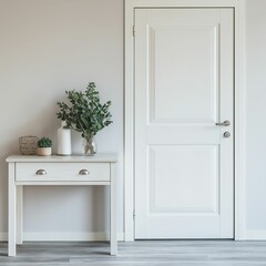 Fototapeta premium Clean, minimal entryway with a white console table, neutral color scheme, and a few decorative items for an uncluttered look.