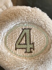 4 on a golf club head cover