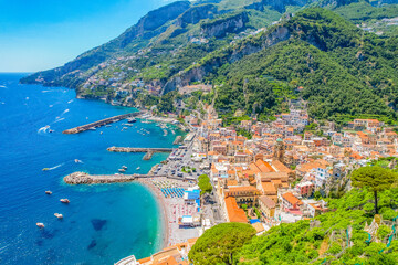 Amalfi on Amalfi Coast, Italy. Aerial photo of famous city Amalfi located on Amalfi Coast with blue sea water and beautiful colorful houses on the cliff