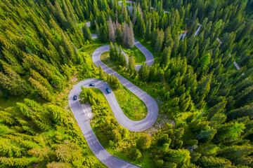 Snake Road in the Dolomites. Sunrise aerial forest